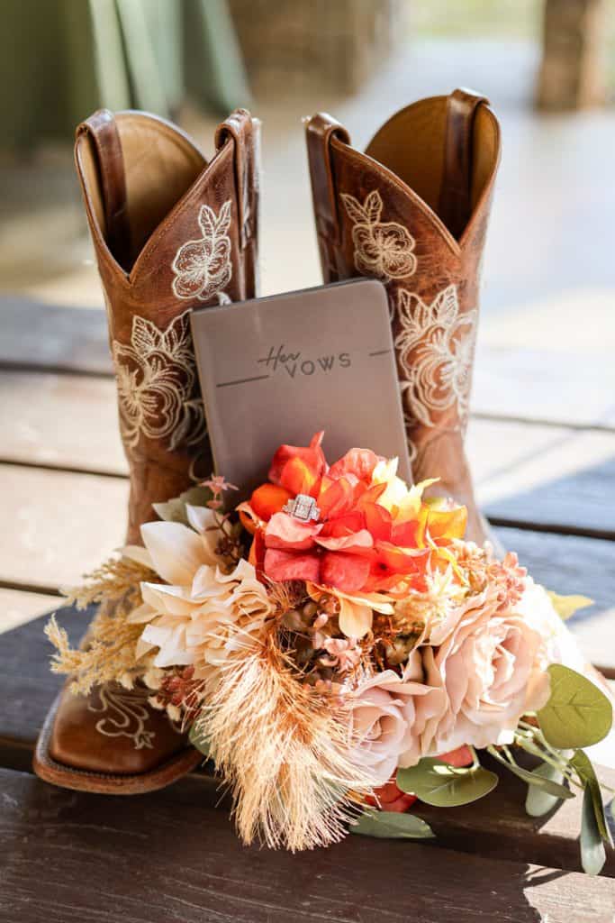 Boots with floral embroidery and a bouquet of flowers and a "How Wows" card.